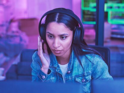 Developer, computer or headphones in neon coding for cybersecurity iot, night SEO thinking or code .